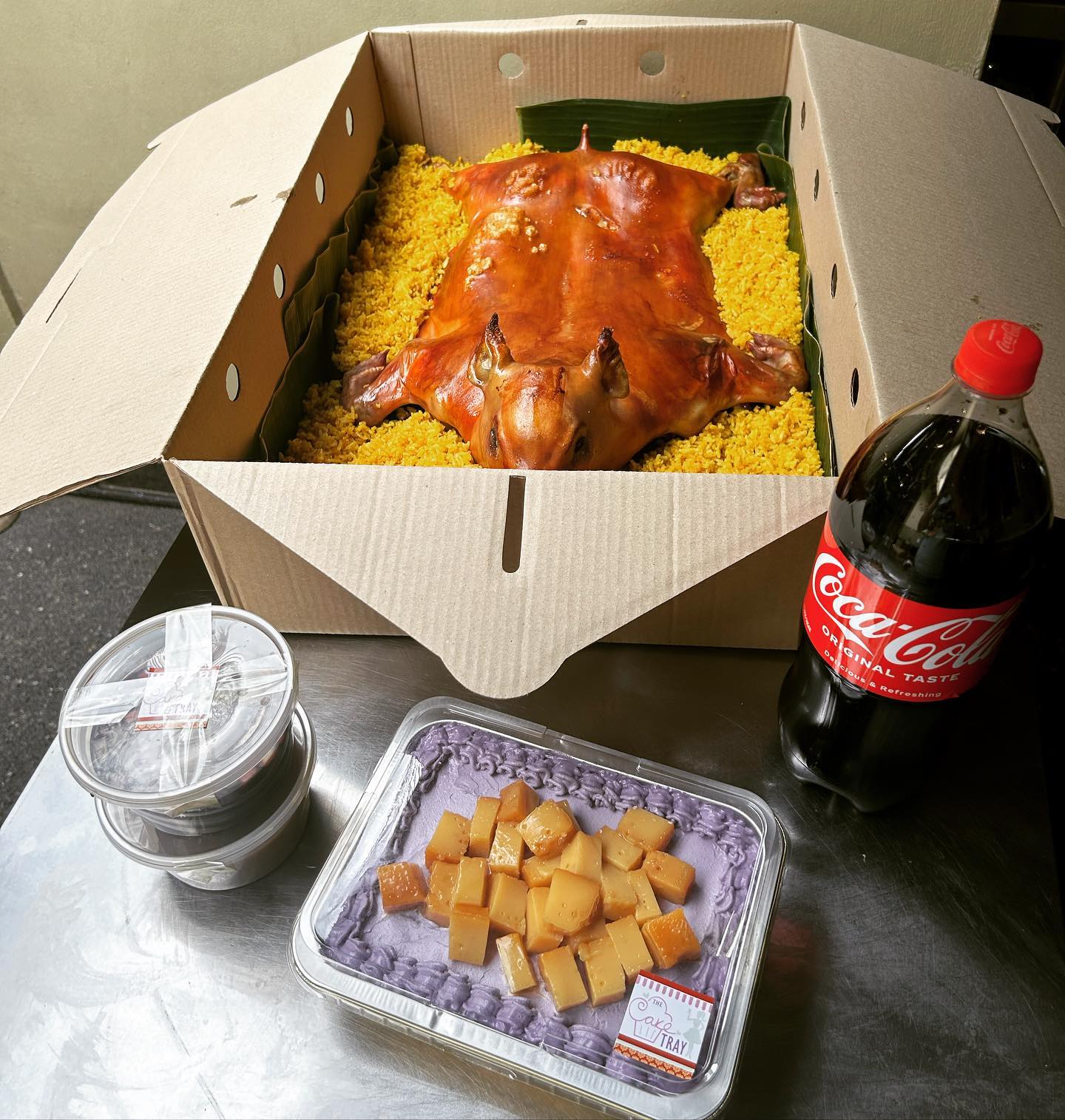 Cochinillo and ube dessert celebration spread